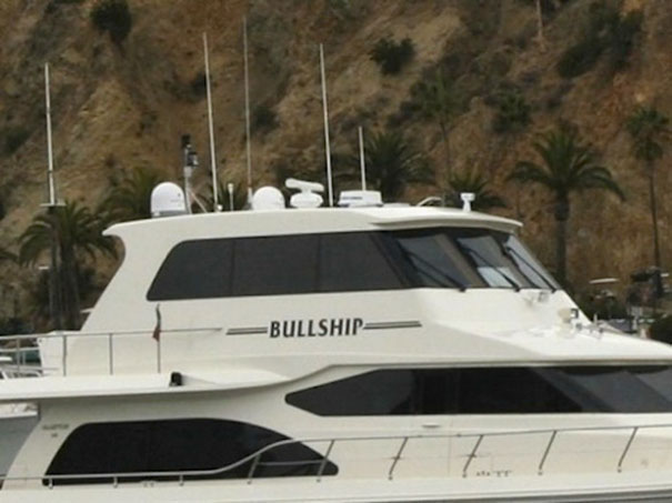 Funny name on a white and black yacht 