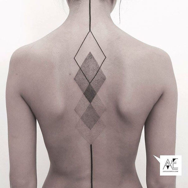 Geometric spine tattoo featuring diamond shapes and fine dot work design.