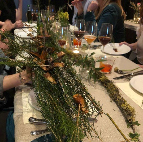 Fermented Plums Served On Pine Branches
