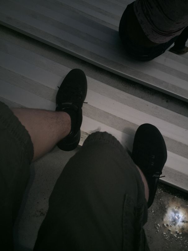 Accidentally Took A Picture Of My Legs During The Eclipse But If You Look In The Bottom Right, You Can Still See It In A Puddle