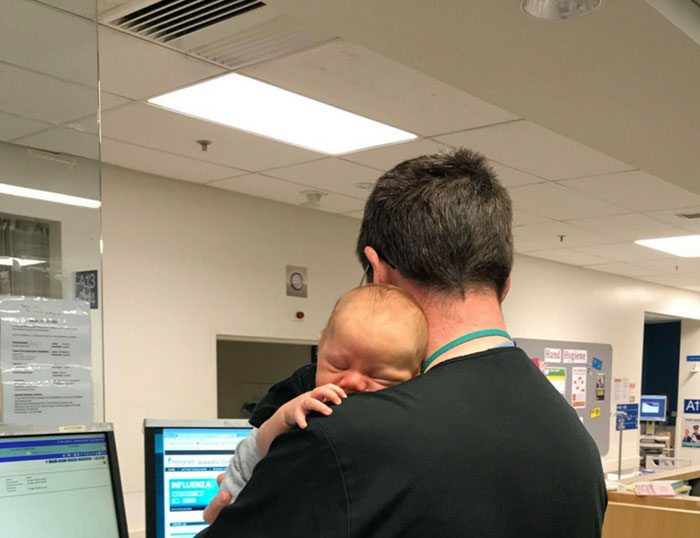 Doctor Ran Emergency Department While Holding A Sleeping Baby, Whose Mom Was Unwell And Needed To Get Tests Done
