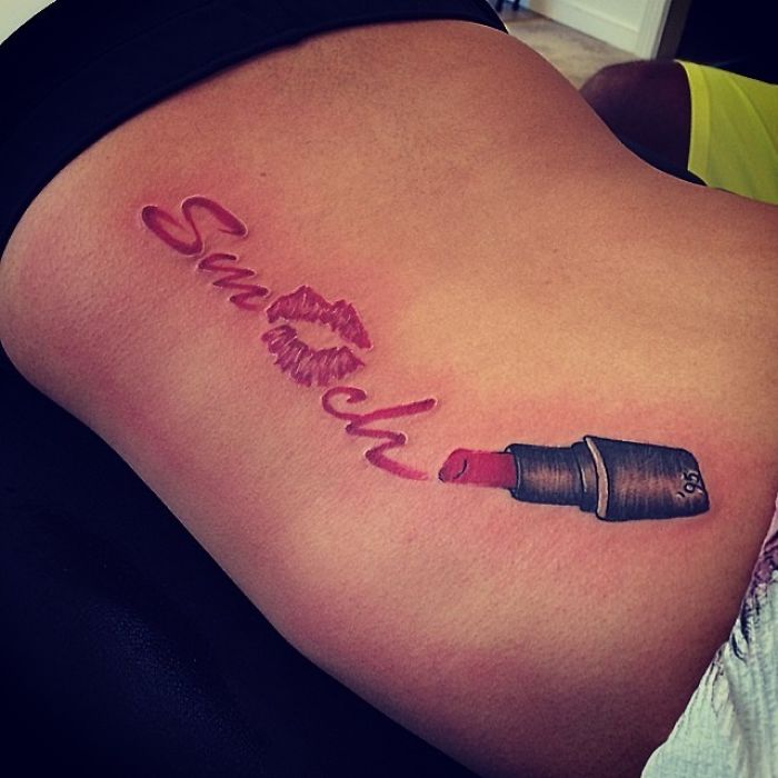 Tattoo shows the word "Smooch" with a lipstick and lip print, demonstrating the artist's skill in capturing a client's wish.