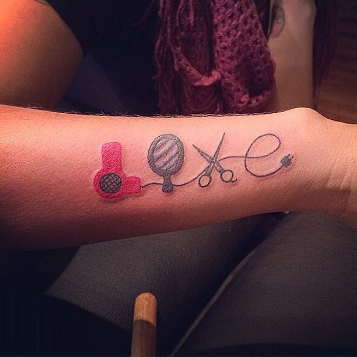 Tattoo showcasing a hairdryer, mirror, scissors, and cord, highlighting a tattoo artist's skill from a funny sketch.