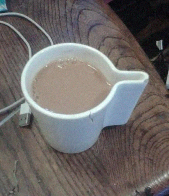 The "Handle" Is Part Of The Container So Not Only Can I Not Hold It, There Is A 100% Chance That I Will Pour Tea On My Face When I Drink