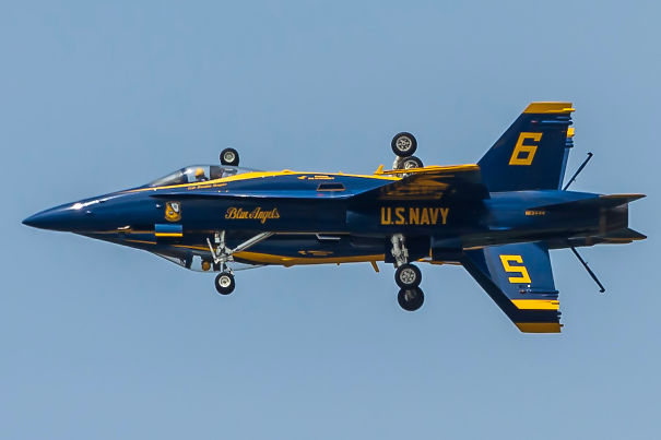 Two Blue Angels F/A-18 Hornets Flying Side-By-Side, One Inverted