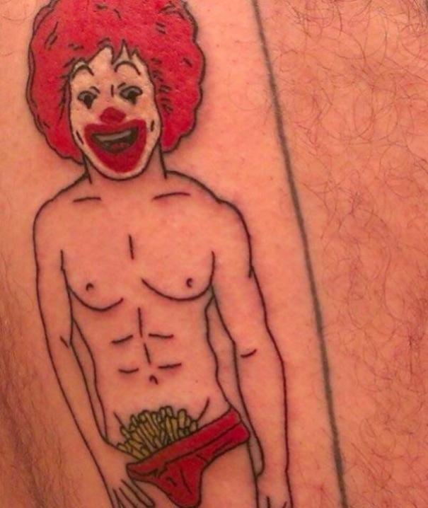 Clown tattoo fail with fries in underwear, highlighting humorous tattoo mistakes.