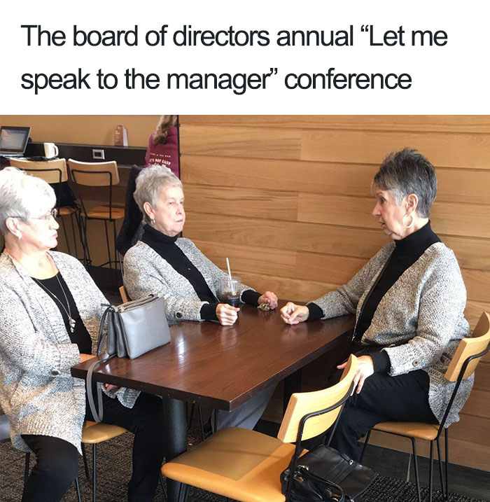 Elderly women in similar outfits at a table, humorously mimicking a restaurant meeting.