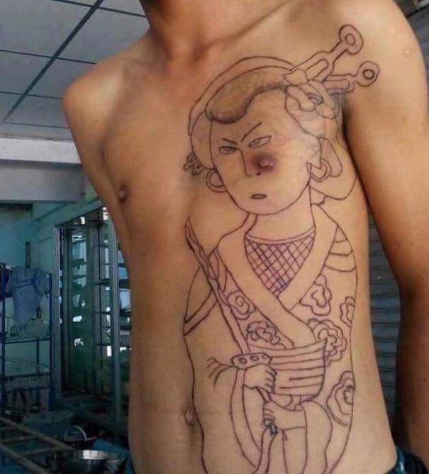 Bad tattoo fail of a geisha outline over a man's chest, awkwardly positioned around his n****e.