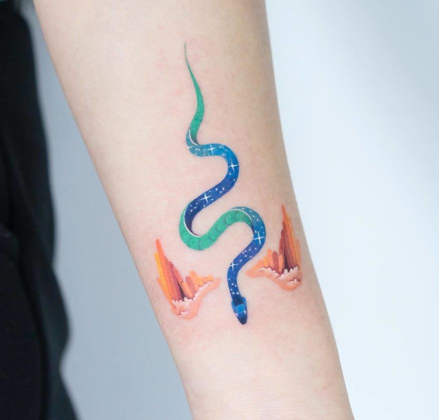 Tattoo featuring a colorful snake design by Korean artist on forearm.