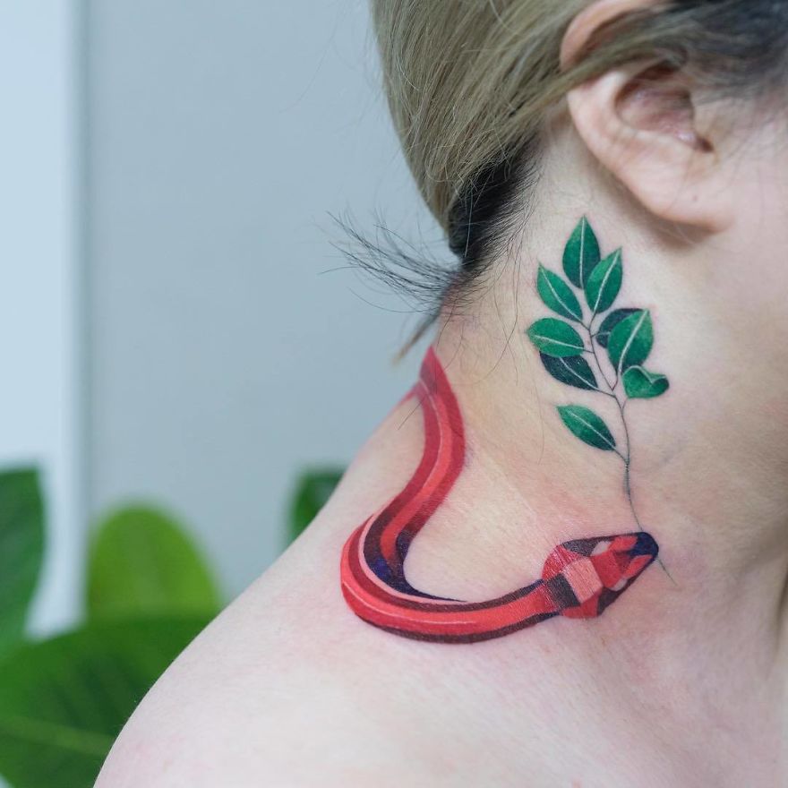 Tattoo of a colorful snake wrapped around leaves on a person's neck by a Korean artist.
