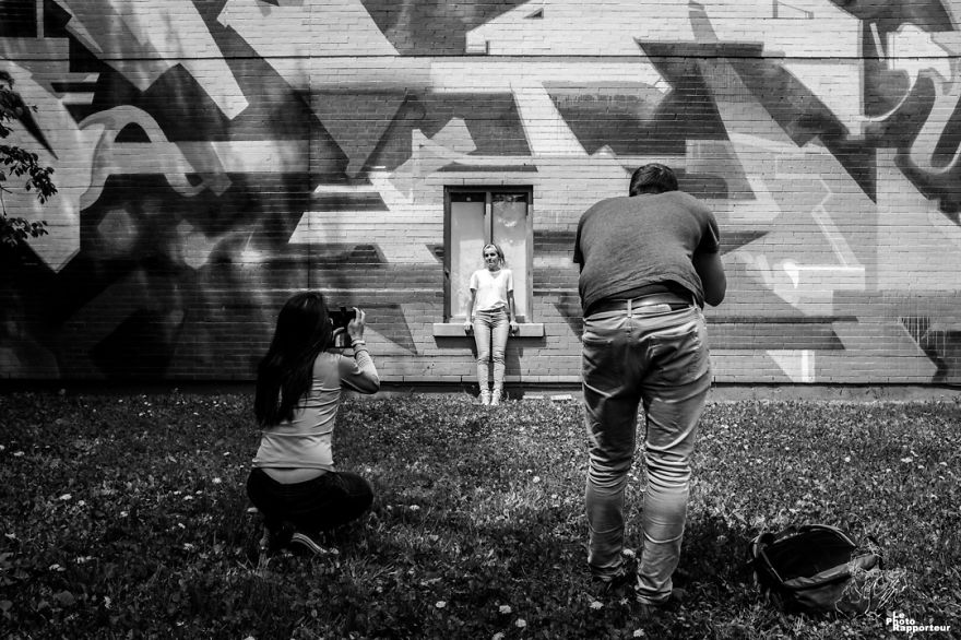 On Saturday, May 19th 2018 At 12:09pm, A Young Woman Was Posing For Two Photographers, On A Window Ledge Covered With Glass Shards