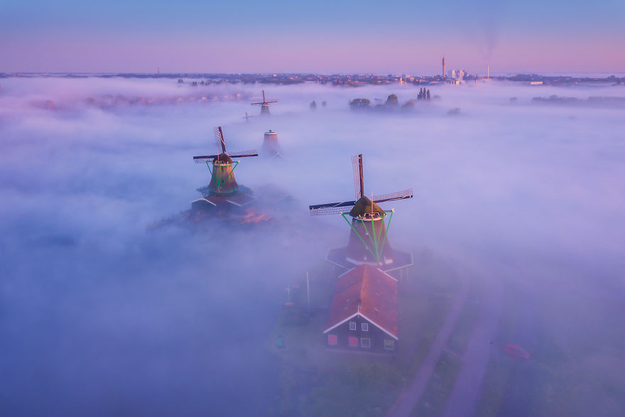 Thick Fog Covering The Ground With The Windmills Sticking Out. An Unreal Sight
