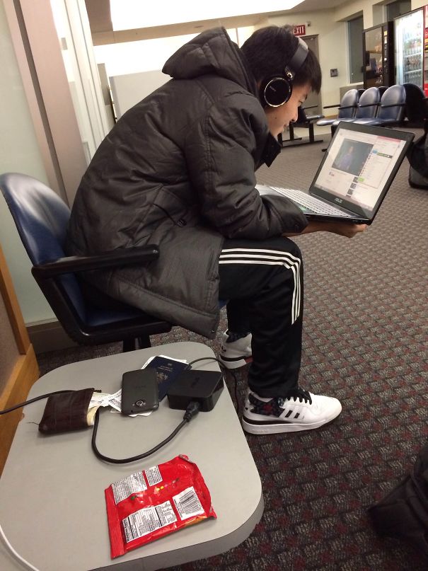 If Ever Someone Was Just Asking To Get Robbed, It's This Guy Sitting Next To Me At The Airport