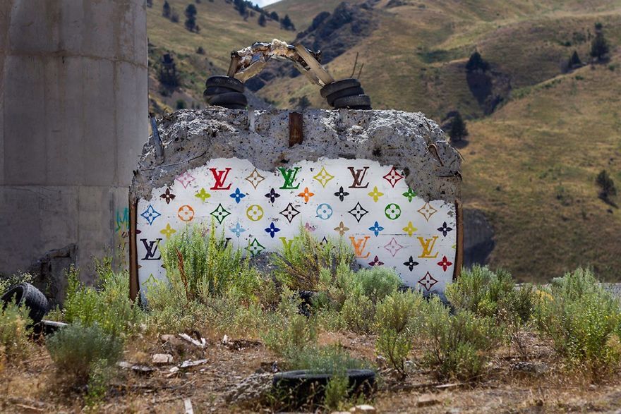 Street Artist Creates ‘Valley Of Secret Values’ By Transforming Crumbling Concrete Structures Into Designer Bags Street Artist Creates ‘Valley Of Secret Values’ By Transforming Crumbling Concrete Structures Into Designer Bags