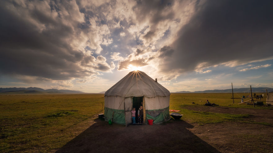 Kids Standing In The Opening Of Their Yurt