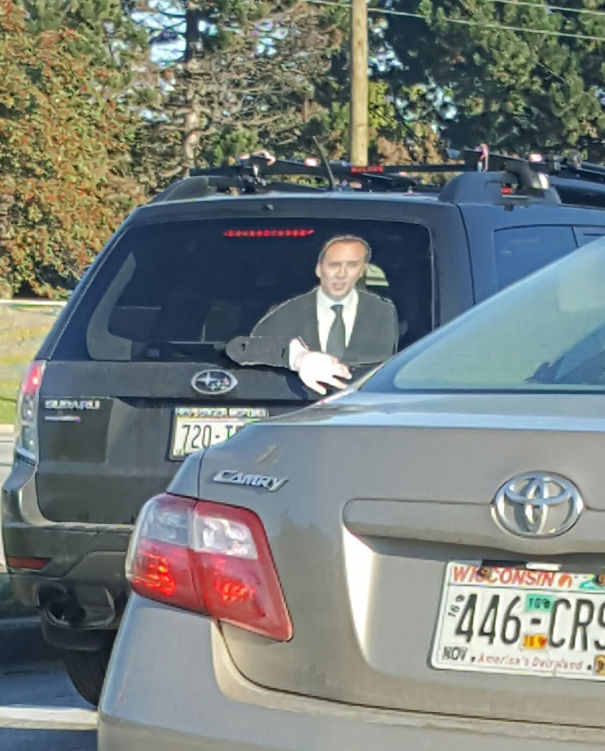 Saw This On My Way To Work Today- They Have A Cardboard Cutout Of Nic Cage In The Back Window, With His Arm Attached To The Rear Wiper, So He Can Wave To Everyone