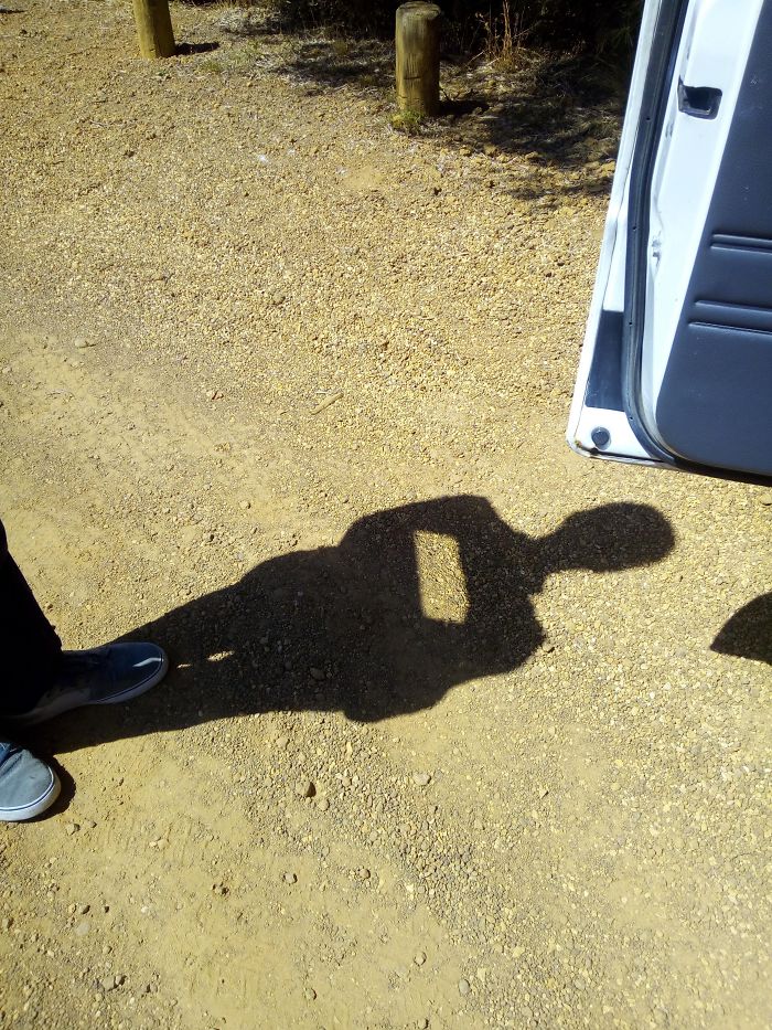 The Reflection Of The Car Mirror Makes It Look Like My Friend Is Missing A Brick