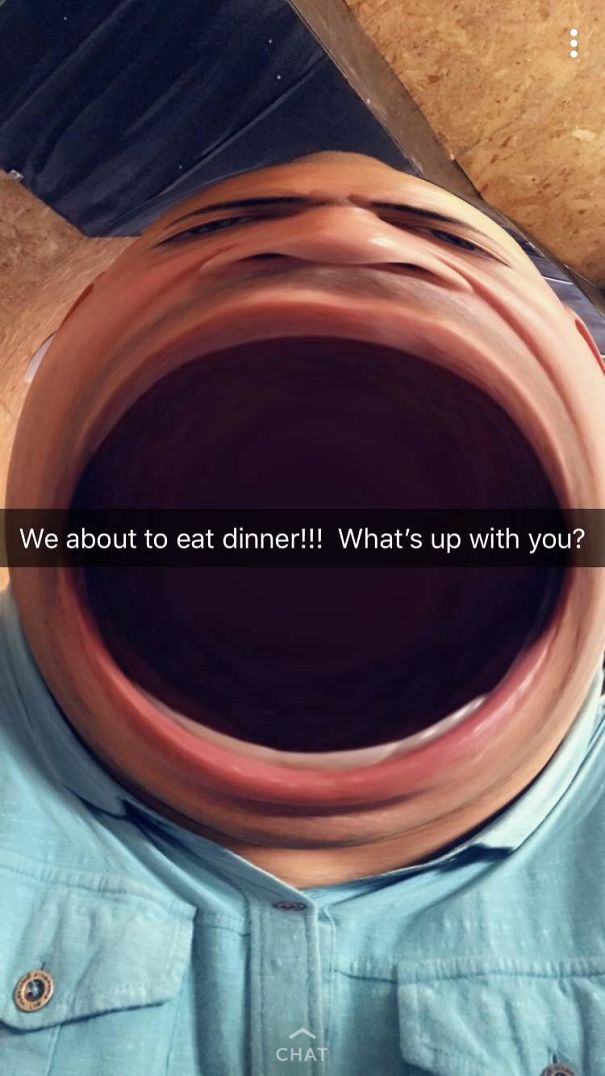A dad with a distorted face filter, humorously expressing excitement about dinner.