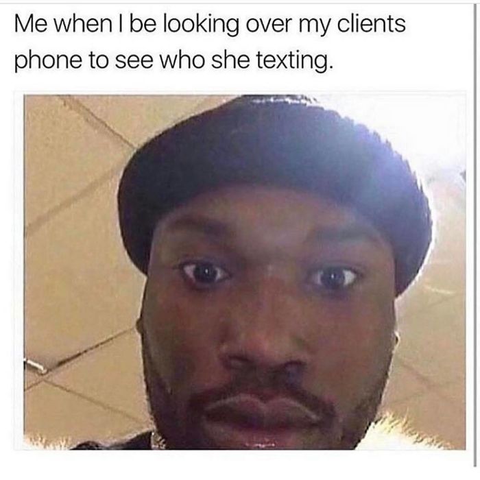 Close-up of a person looking surprised, capturing a humorous moment related to hairstylist memes.