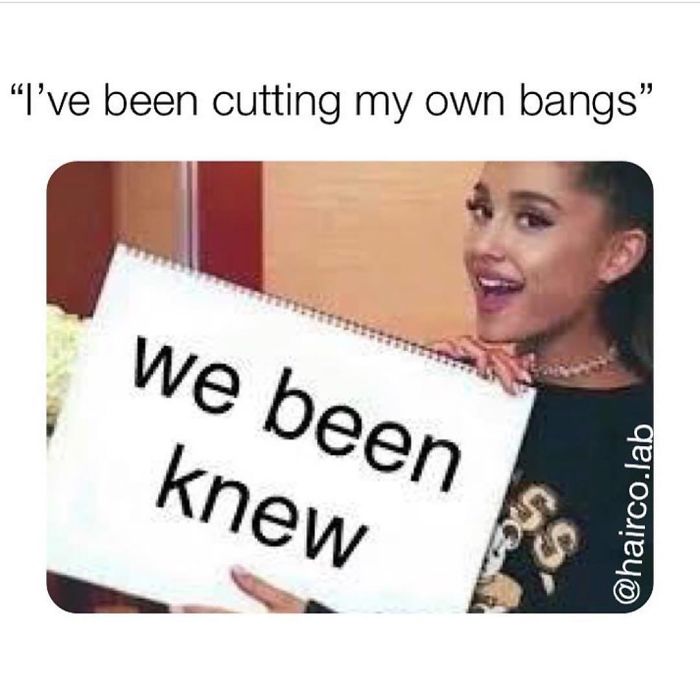 Woman holding a sign saying "we been knew" about cutting her own bangs, related to hairstylist memes.