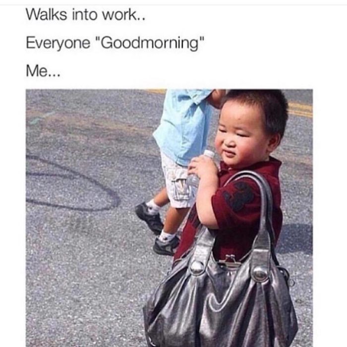Cute toddler with a large handbag, wincing in the sun and holding a water bottle, humorously portraying morning mood.