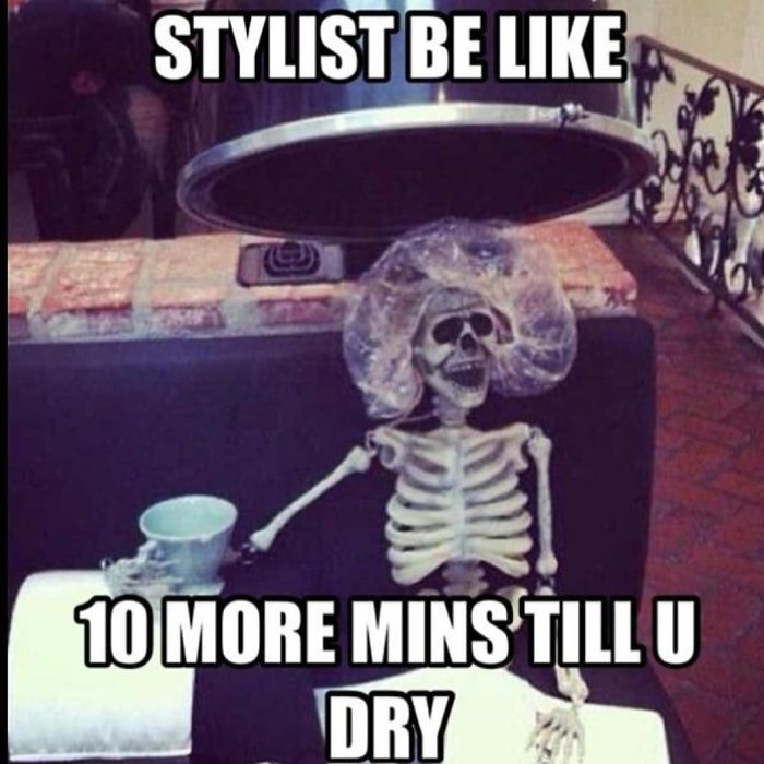 Skeleton under a hair dryer with caption about hairstylist waiting times, creating a humorous meme.