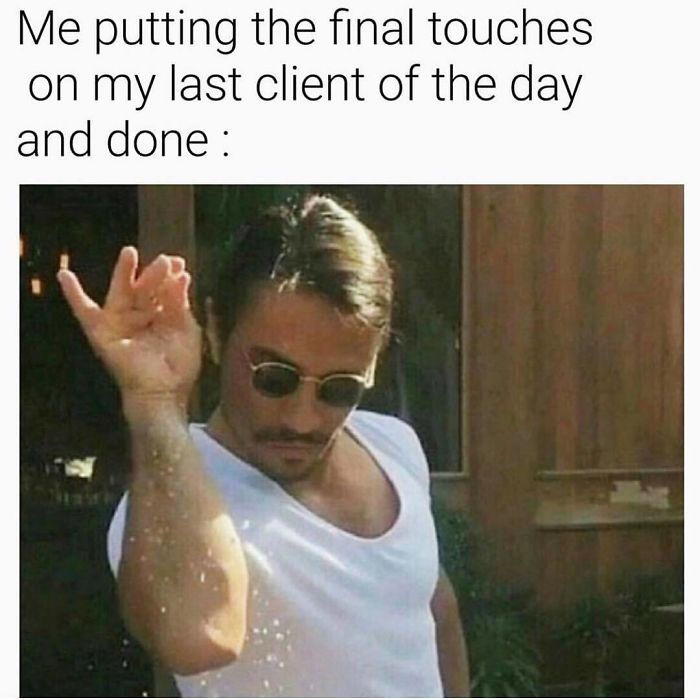 Man in sunglasses sprinkling salt, humorously mimicking a hairstylist's final touches on a client's hair.