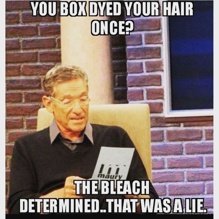 TV host holding a card on a show with text about hair dying, humorously relating to hairstylist challenges.