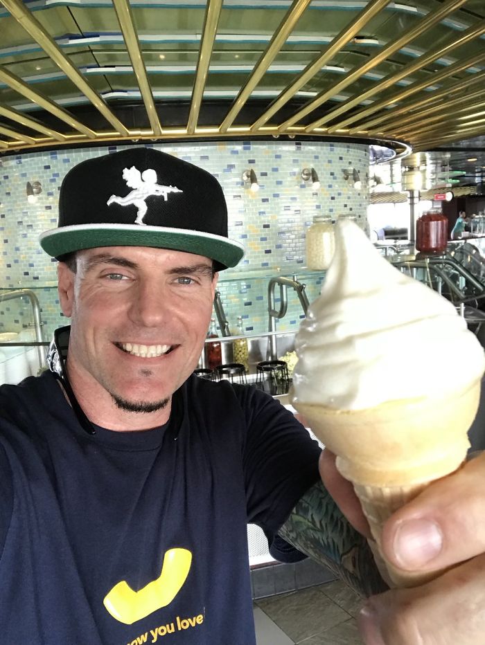 Vanilla Ice holding ice creams and smiling