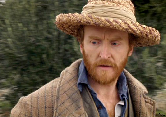 Tony Curran wearing hat and looking