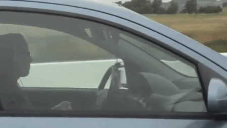 Knitting And Driving, With Headphones On And Visor And Review Mirrors Pointed Down, I Suppose To Help See The Knitting While Looking Up?