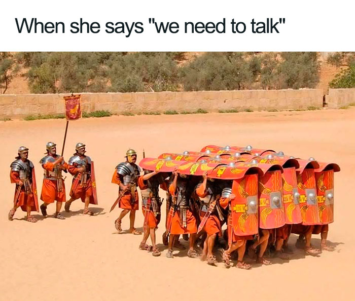 Roman soldiers forming a shield wall in formation, a humorous ancient Roman meme about confrontation and defense.
