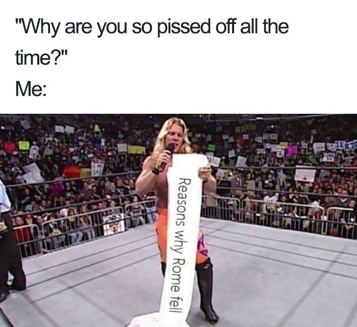 Wrestler holding a long scroll labeled Reasons why Rome fell in a crowded arena, ancient Roman memes humor context.