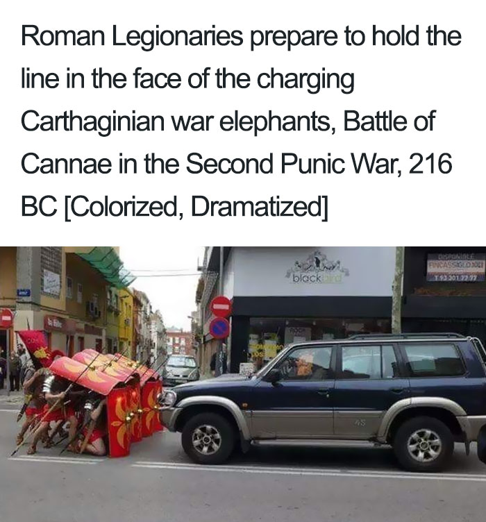 Roman legionaries in formation holding shield wall facing an SUV, a humorous take on ancient Roman memes.