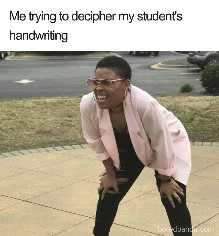 Person in pink jacket squinting and leaning forward, depicting teacher meme about deciphering student handwriting hardships.