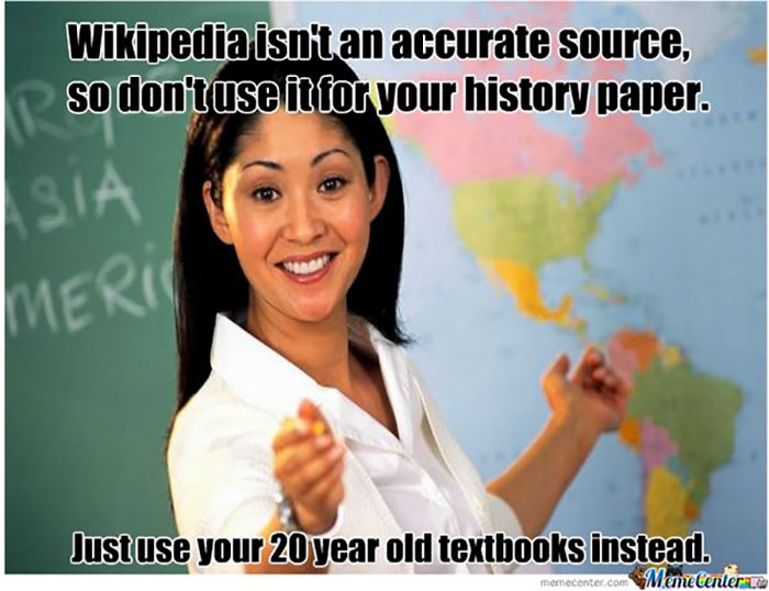 Teacher meme highlighting Wikipedia vs. textbooks with a smiling educator pointing at a map.