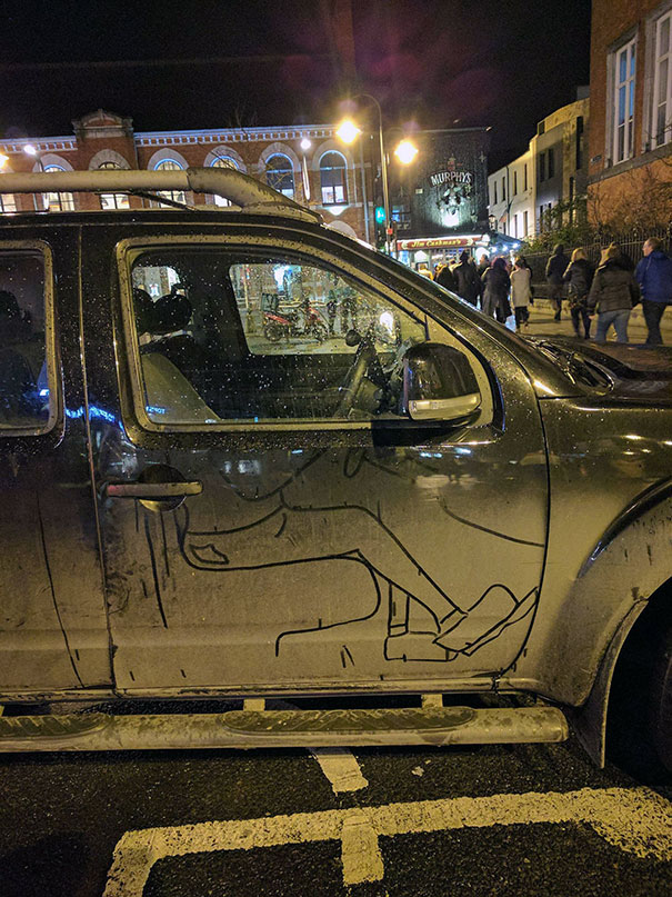 Someone Drew The Drivers' Legs In The Dirt On This Car
