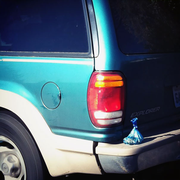 Snapped This In Traffic This Morning. Bag Of Dog Poop On A Car Bumper