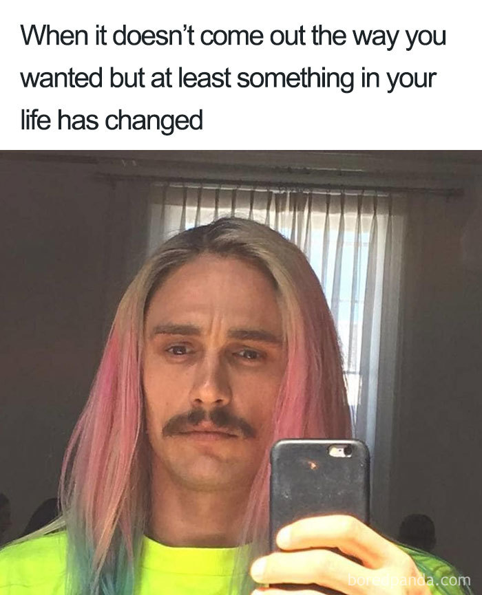 Man with long, colorful hair and mustache taking a selfie in the mirror, humorous meme about hairstylist struggles.