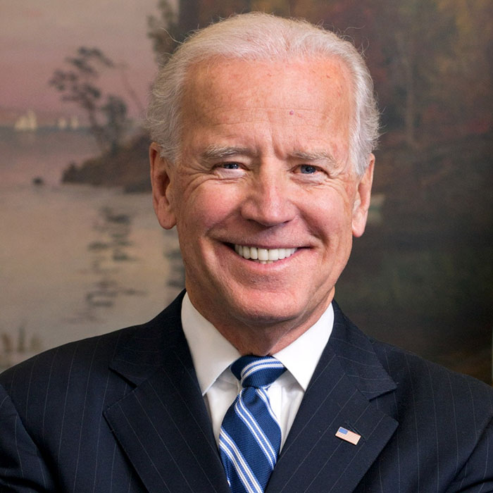 Joe Biden wearing suit and smiling