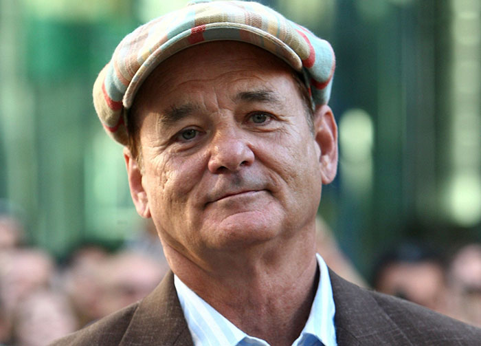 Bill Murray wearing brown suit and smiling