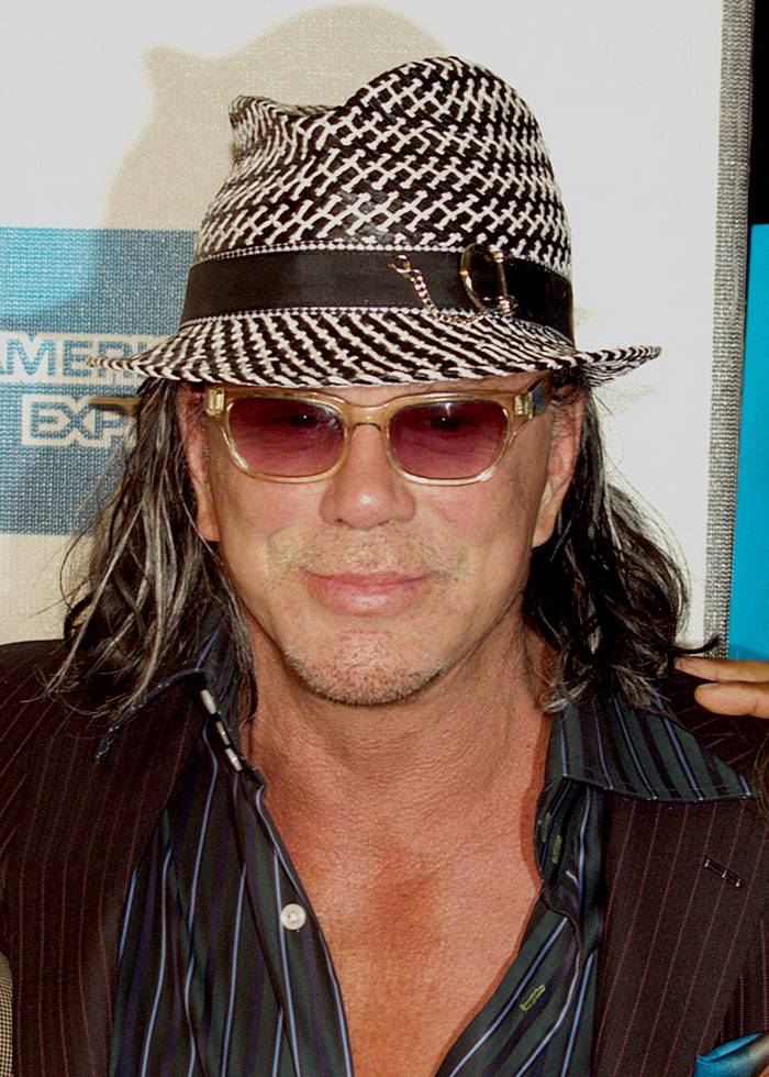 Mickey Rourke wearing hat and glasses