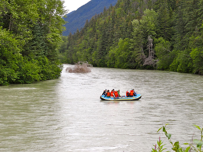 Boat full of people sailing on the river