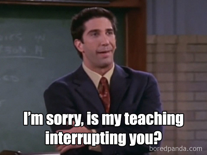 Man in a suit with a sarcastic expression, embodying teacher hardship meme humor.
