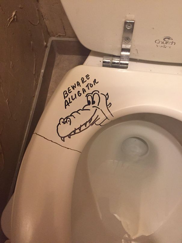 Funny dad joke on toilet seat with a doodle of an alligator and text "Beware Alligator".