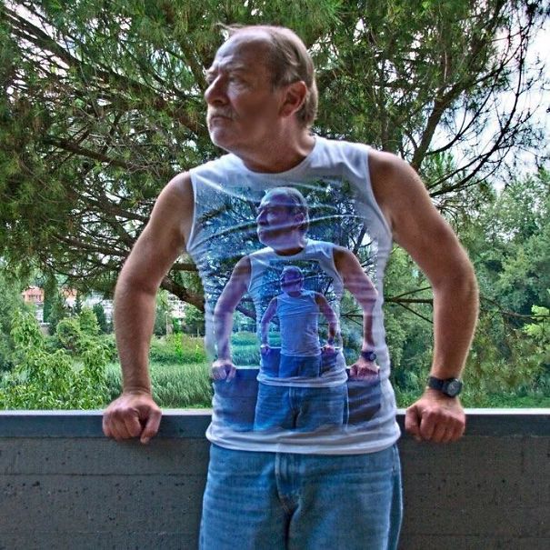 Funny dad wearing a shirt printed with his own image in a humorous scene outdoors.