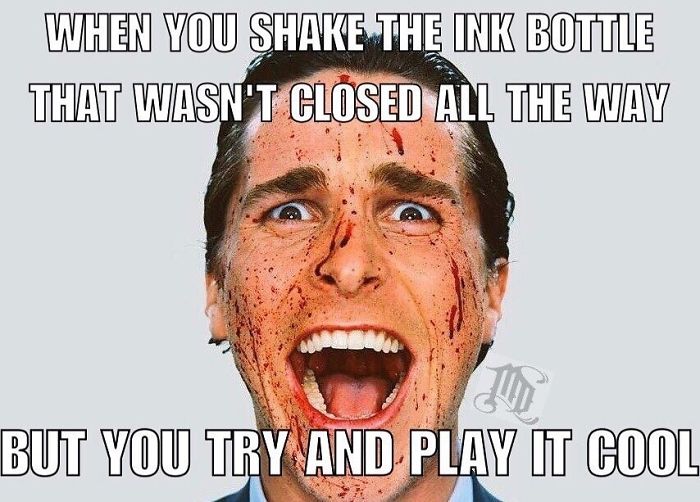 Close-up of a man with ink splatter on his face, grinning widely, illustrating a tattoo meme scenario.