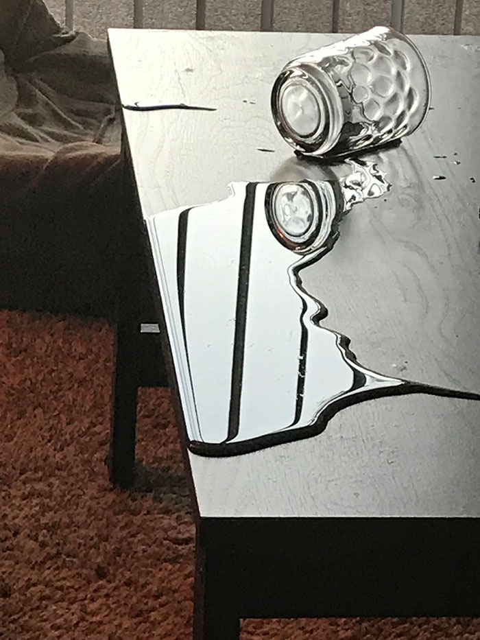 Our Cat Spilled A Glass Of Water On The Coffee Table, But None Of It Got On The Floor