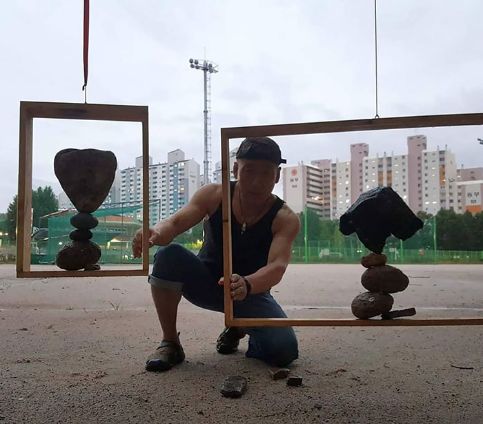 Couple Frame Balancing On The Rainy Day