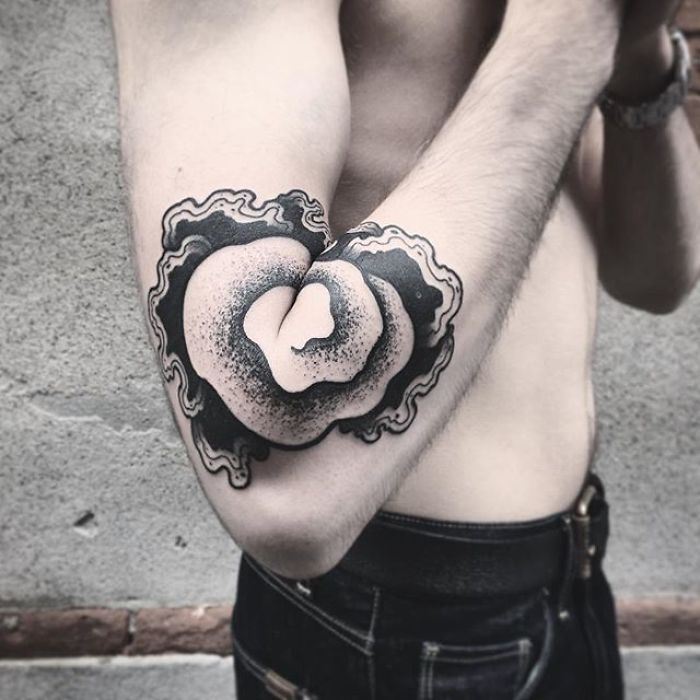 Unique arm tattoo design revealed by extending the elbow. Unique arm tattoo design revealed by extending the elbow.